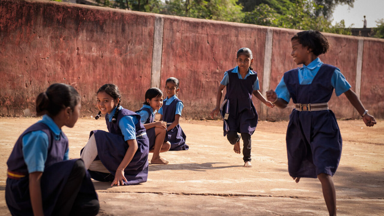 Young girls playing sports at school